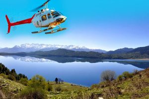 Helicopter flying over rara Lake